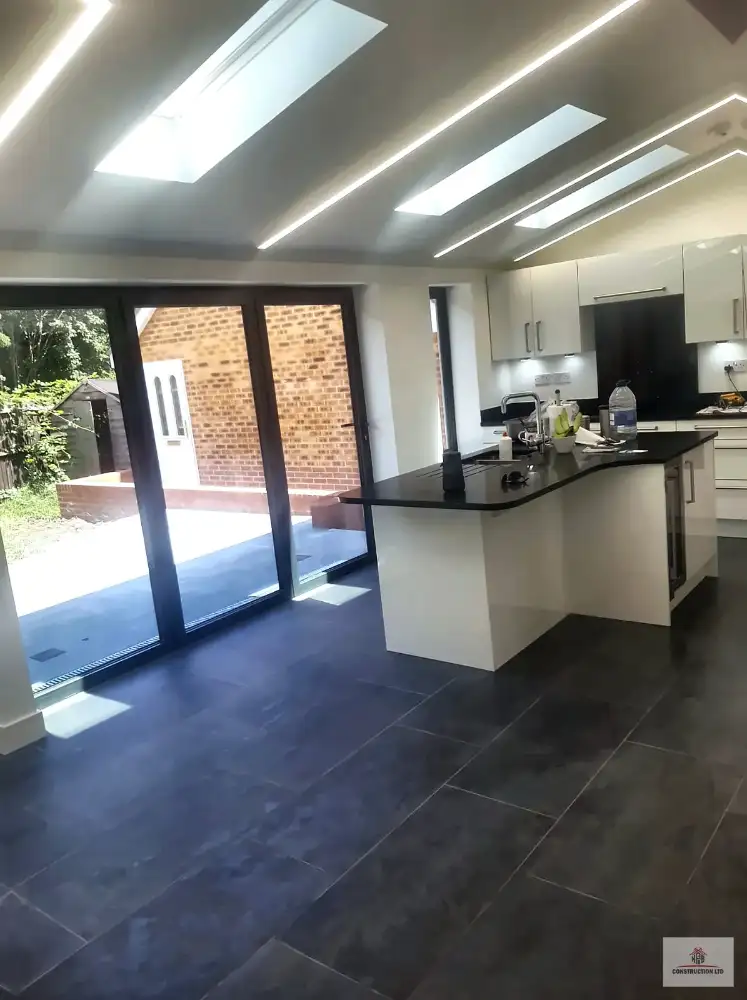 Plastered extension interior with bifold doors