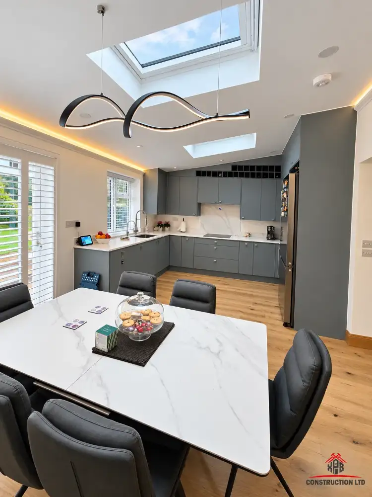 Kitchen-diner inside a single-storey rear extension with two rooflights