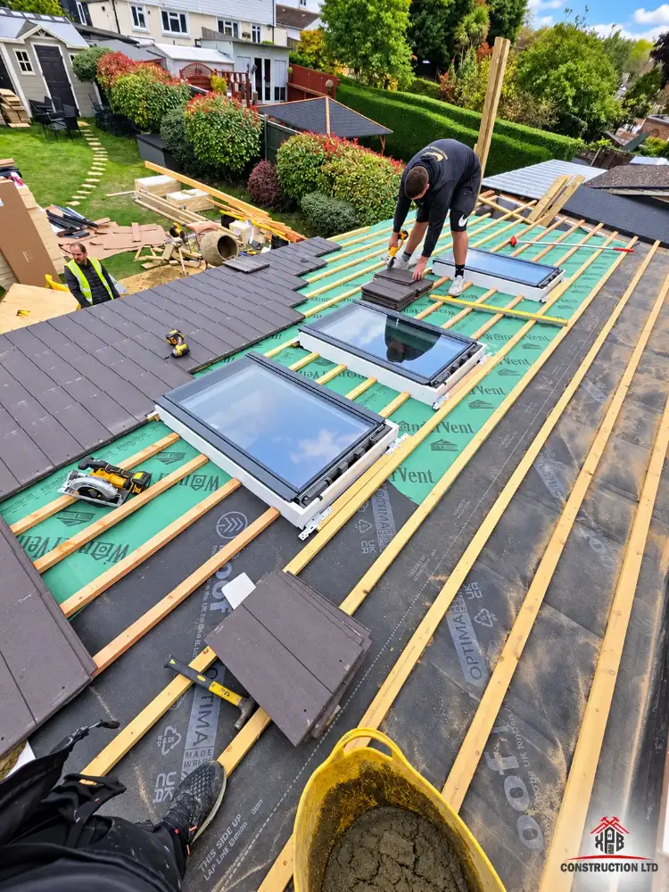 The team fitting rooflights on a new extension roof